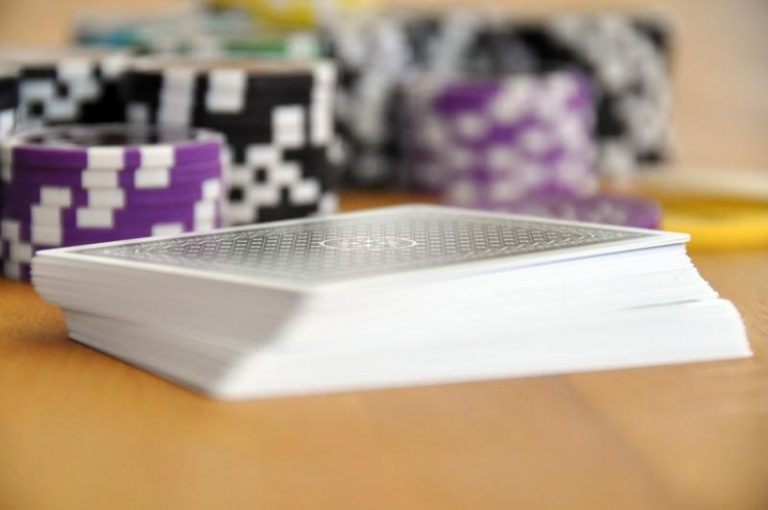 what is a straight in poker - stack of playing cards